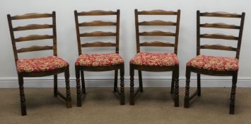 Set four early 20th century oak ladder back chairs, upholstered seat, turned supports,