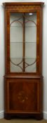 20th century mahogany floor standing mahogany display cabinet, projecting cornice,