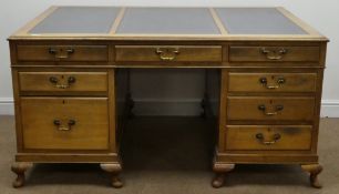 Early 20th century walnut twin pedestal partners desk, three piece leather inset moulded top,