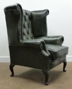 Georgian style wing back armchair upholstered in deeply buttoned green leather, cabriole feet,