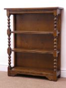Old Charm oak four tier open bookcase, moulded top, carved frieze, turned supports, W76cm, H96cm,