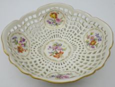 19th century KPM Berlin porcelain basket with five panels hand painted with floral sprays, D19.