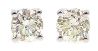 Pair of 18ct white gold (tested) diamond stud earrings, diamonds approx 1.