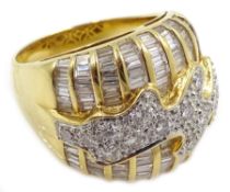 Heavy 18ct gold baguette and round brilliant cut diamond ring, with central wave design,