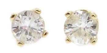 Pair of diamond stud earrings stamped 14K, diamonds approx 0.