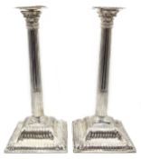 Pair of Victorian silver corinthian column candlesticks, pierced capitals,