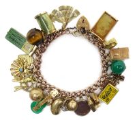 9ct rose gold bracelet with unusual gold charms including matchbox, driving license, cheque book,