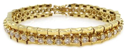 Gold diamond line bracelet consisting of forty three brilliant cut diamonds,