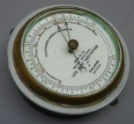 Circular metal cased 'Fishermans Aneroid Barometer' issued by the Royal National Life Boat