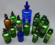 Fourteen apothecary's various sized coloured glass bottles with stoppers comprising large blue Syr.