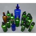 Fourteen apothecary's various sized coloured glass bottles with stoppers comprising large blue Syr.