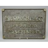 Rectangular brass plaque, lettered in relief 'Wilson Noble & Co. Shipbuilders.