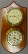 Sestrel brass cased Aneroid Barometer, circular cream dial with red pointer and a bulkhead clock,