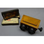 Unis-France stereoscopic viewer in shaped mahogany case with adjustable focus knob and three boxes
