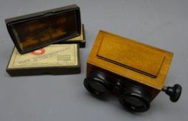 Unis-France stereoscopic viewer in shaped mahogany case with adjustable focus knob and three boxes
