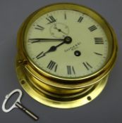 Ship's brass cased bulkhead clock,