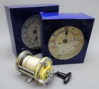 Garcia Mitchell 600A multiplier fishing reel and two Neptune's Tide Clocks unopened in boxes (3)