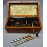 Evans & Stevens brass and steel 'Improved Magneto Electro Machine' in mahogany case,
