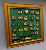 Framed display of thirty Merchant Navy and other cap badges mostly bullion wire work decorated