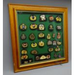 Framed display of thirty Merchant Navy and other cap badges mostly bullion wire work decorated