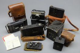 Seven vintage cameras comprising Contessa Pixie 4 x 6cm compact strut camera c1913, Kodak No.