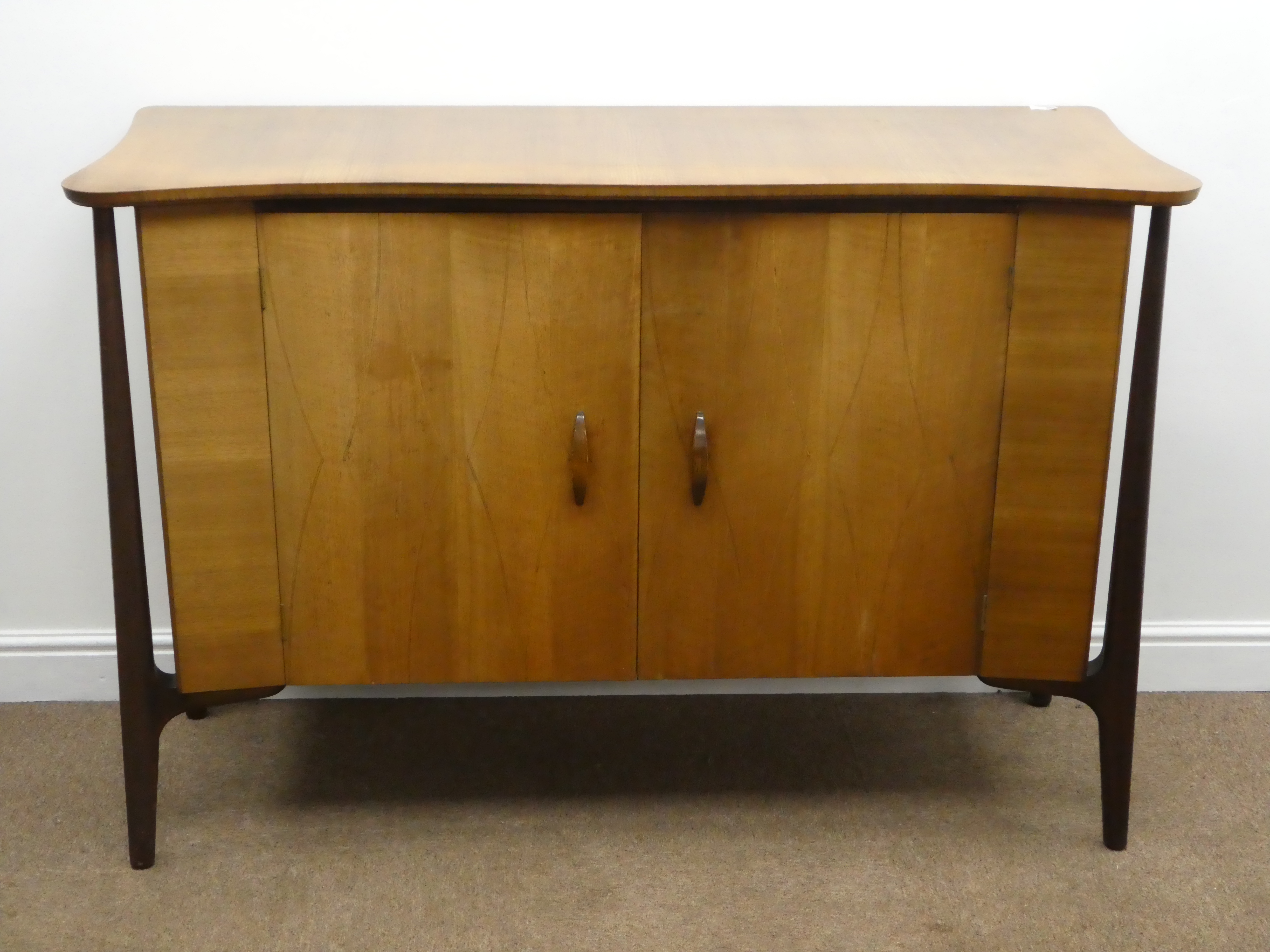 Mid 20th century teak side board, shaped top, two doors enclosing fitted maple interior, - Image 2 of 4