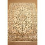 Kashan beige and ground rug, central medallion, floral field with repeating border,