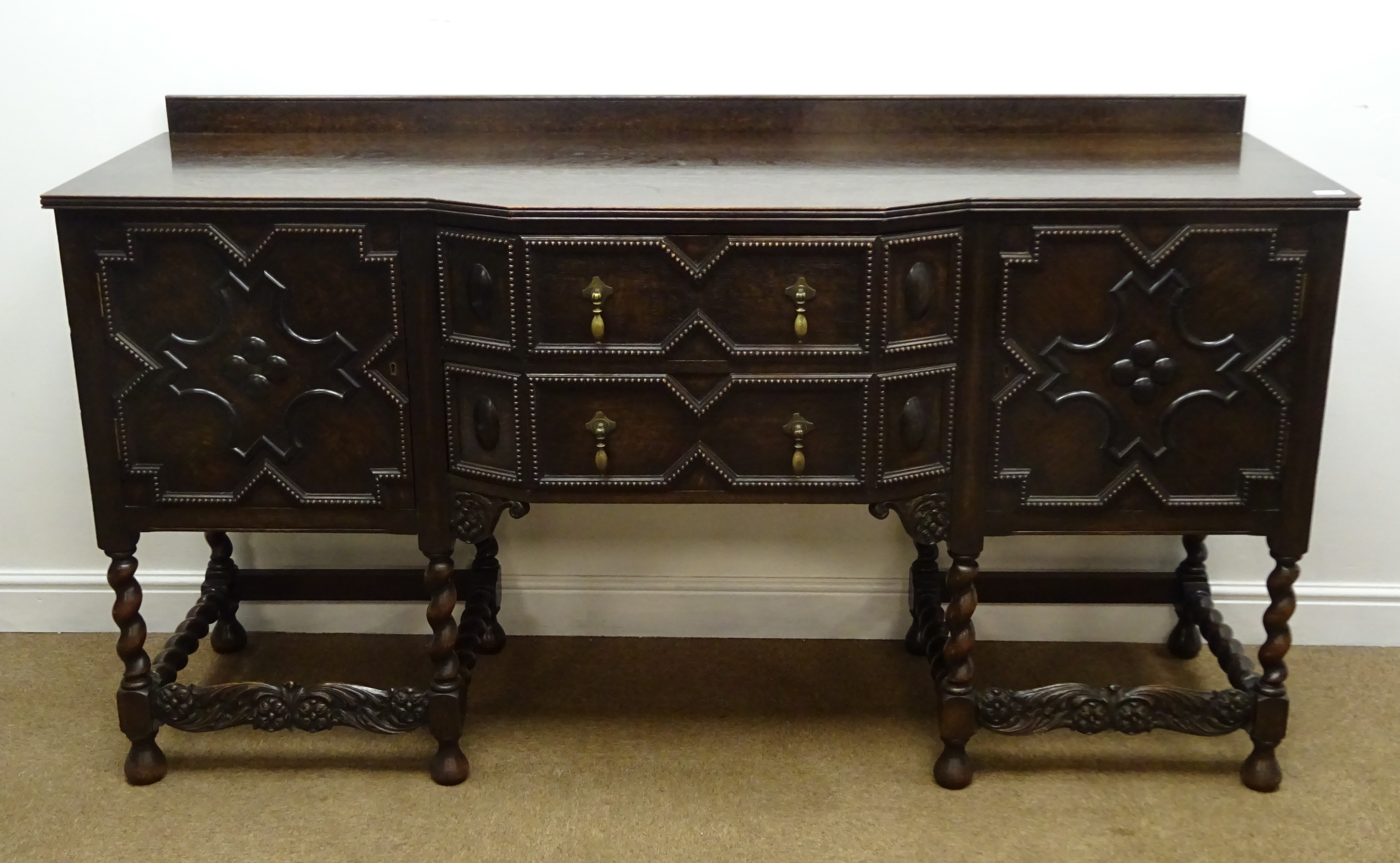 Early 20th century oak break front sideboard, raised back,