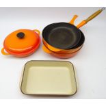 Three Le Cruset sauce pans, shallow casserole with cover and rectangular roasting dish,
