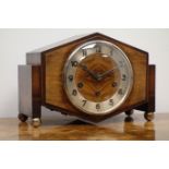 Art Deco walnut and oak mantel clock, angular case with silvered Arabic dial,