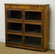 Pitch pine bookcase, six glazed doors enclosing three shelves, solid end supports, W93cm, H93cm,