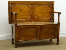 Early 20th century oak monks bench, hinged lid, panelled sides, square supports, W112cm, H94cm,
