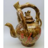 Massive Chinese brown glaze teapot with naturalistic branch work handle and Dog of Fo finial,