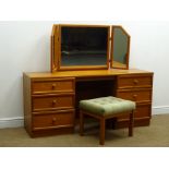 G-Plan teak dressing table, raised three piece mirror back, six graduating drawers,