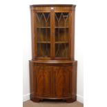 Reproduction mahogany double bow front corner cabinet, projecting cornice, dentil frieze,