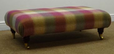 Large rectangular stool, upholstered in a tartan fabric, turned supports on castors, W105cm, H35cm,