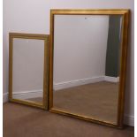Small oval bevel edge wall mirror in gilt swept frame (W45cm,