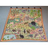 Large Crewelwork tapestry wall hanging decorated with a Jungle scene with Elephants, Antelope,