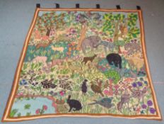 Large Crewelwork tapestry wall hanging decorated with a Jungle scene with Elephants, Antelope,