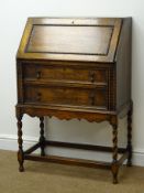 Early 20th century oak bureau, fall front, enclosing fitted interior, two drawers,