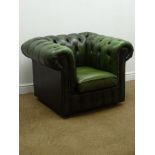 Chesterfield armchair upholstered in deeply buttoned green leather,