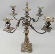 Old Sheffield plate five light candelabra, scroll arms, foliate embossed stem on shaped square base,