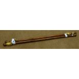 Two medium wood and gilt circular curtain poles with round finials,