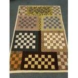 Vintage patchwork quilt made up of square panels in various chintz and other patterned fabric,