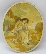 George lll oval silk work picture embroidered with a lady seated in a wooded landscape with dog,