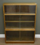 Mid 20th century oak stepped library style bookcase, two compartments with sliding glazed doors,