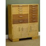 Light wood and teak dentists cabinet, thirteen graduating drawers and three cupboard doors,