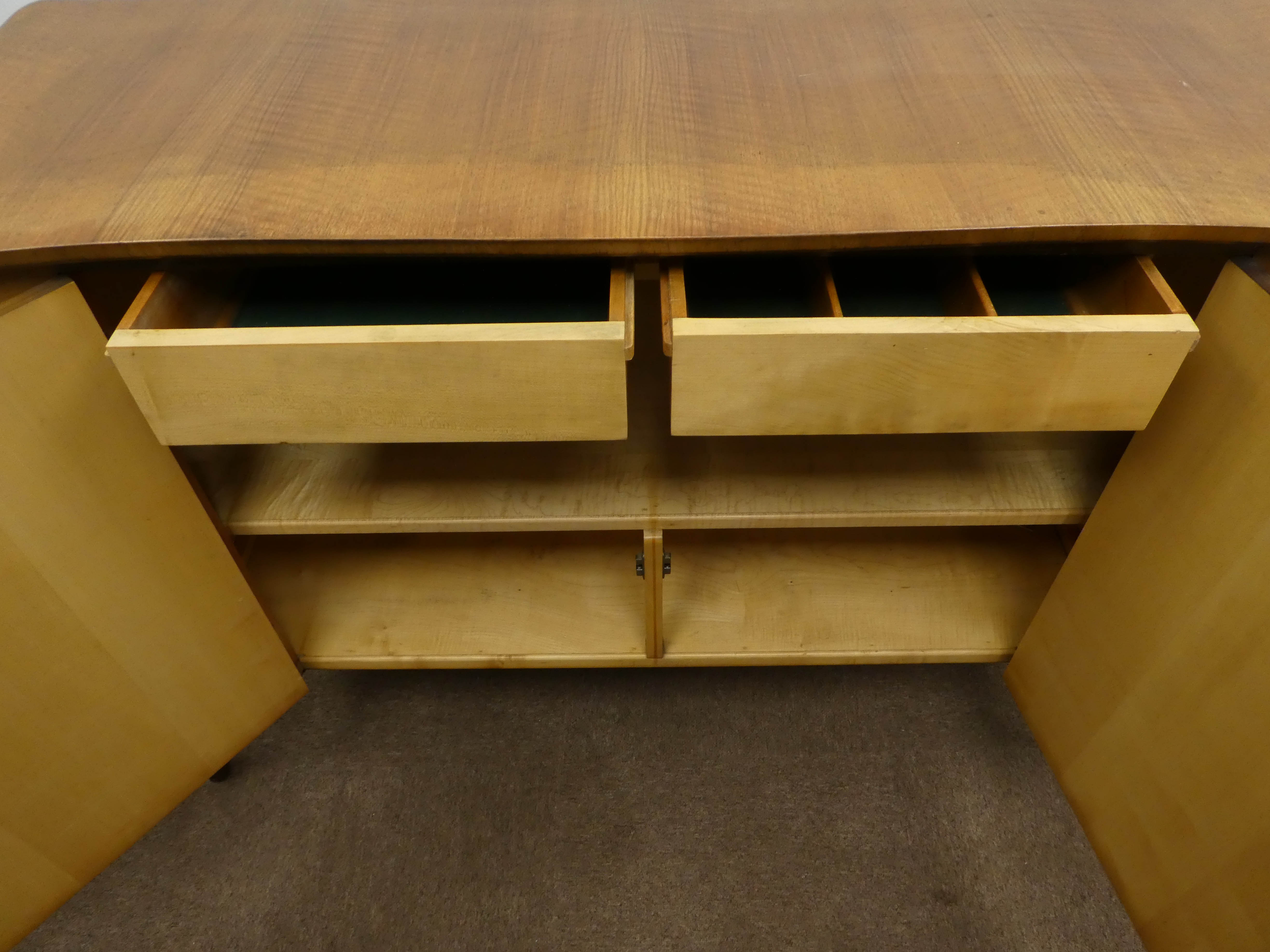 Mid 20th century teak side board, shaped top, two doors enclosing fitted maple interior, - Image 4 of 4