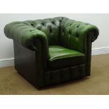 Chesterfield armchair upholstered in deeply buttoned green leather,