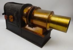 Victorian brass magic lantern with black japanned tin case,